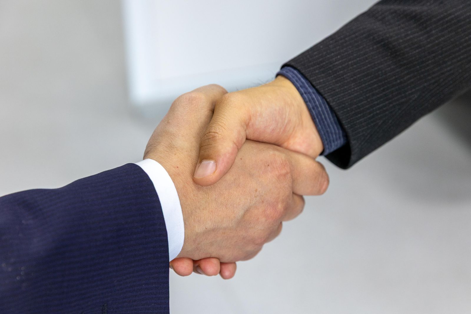 Business owners greeting one another at a meeting